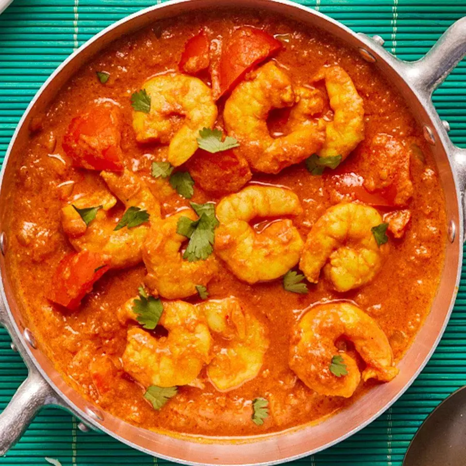 Shrimp tikka masala in a steel pan